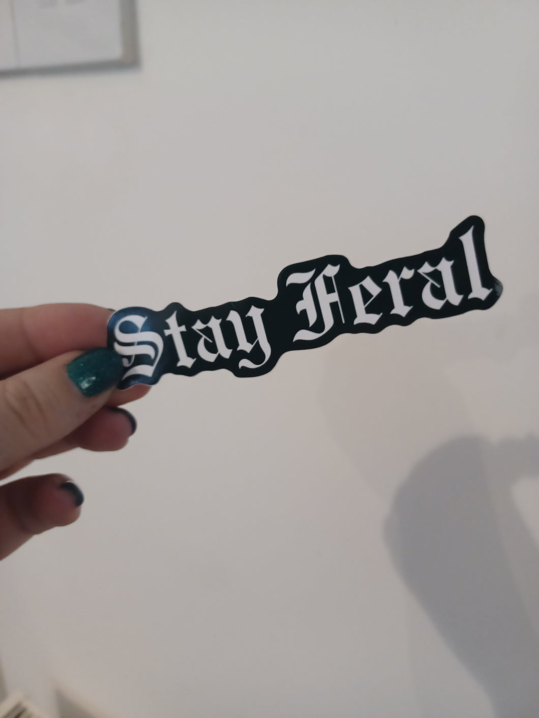 Stay feral sticker